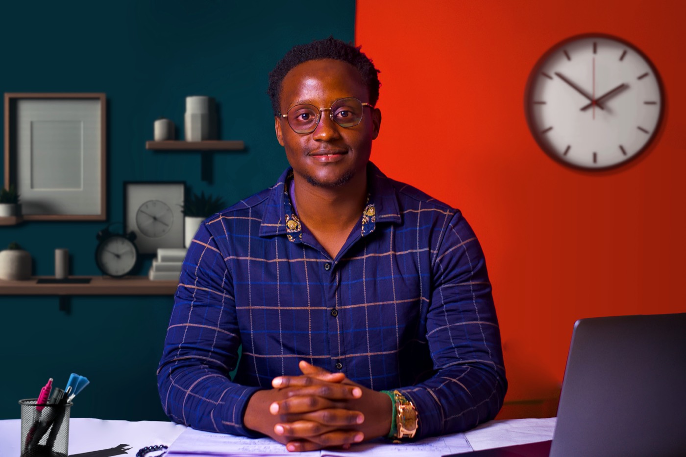 William, founder of Kajama Studios, at his desk